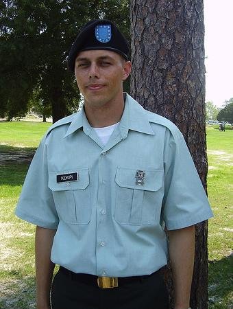 Daniel Kekipi standing outdoors in Army Class-B short sleeve dress shirt and beret