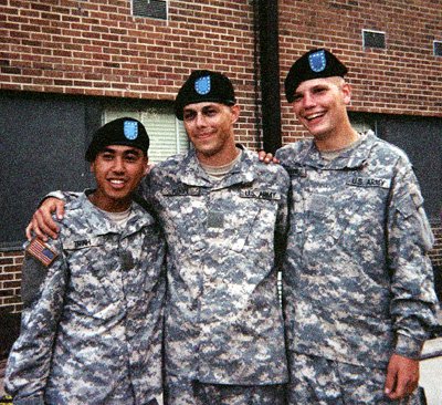 Daniel Kekipi in army battle uniform with two fellow recruits at basic training